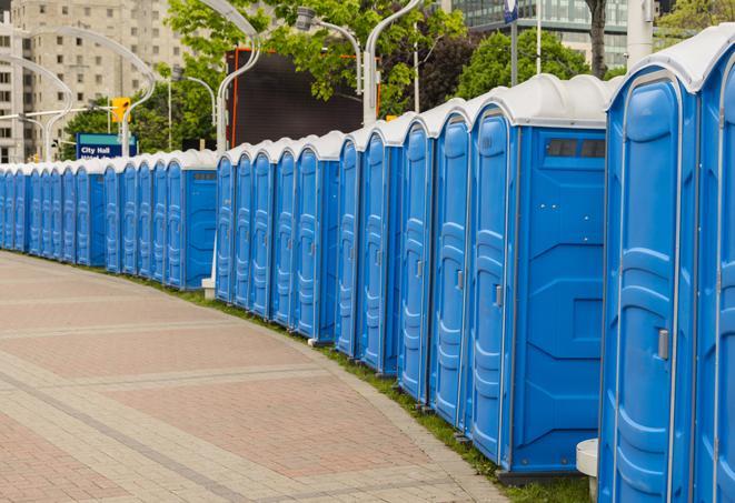 a row of portable restrooms at a fairground, offering visitors a clean and hassle-free experience in hebron